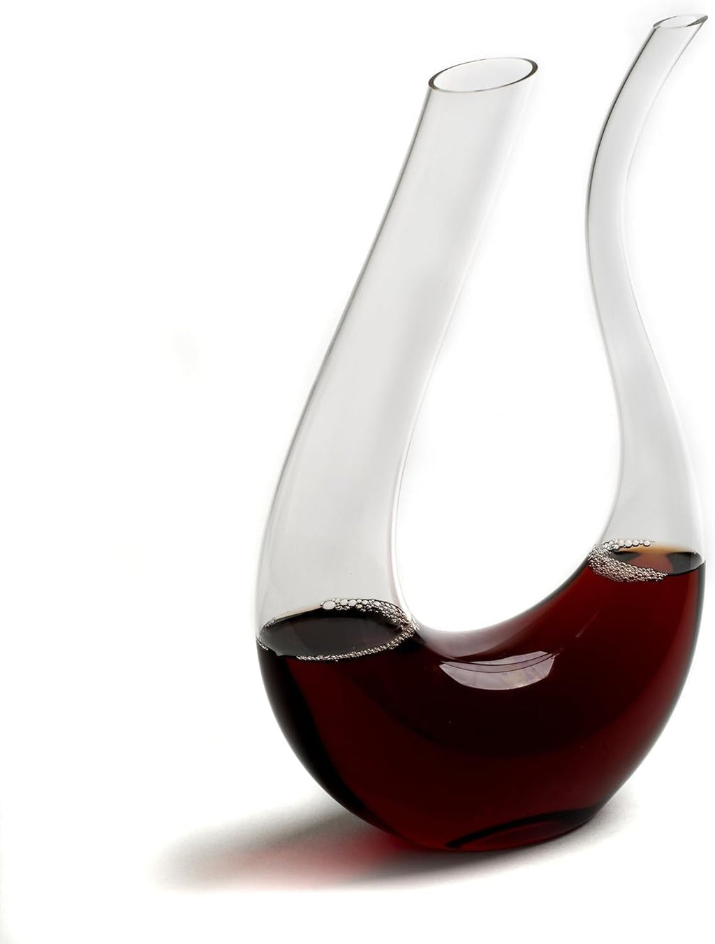 Wine decanter with red wine on a white background